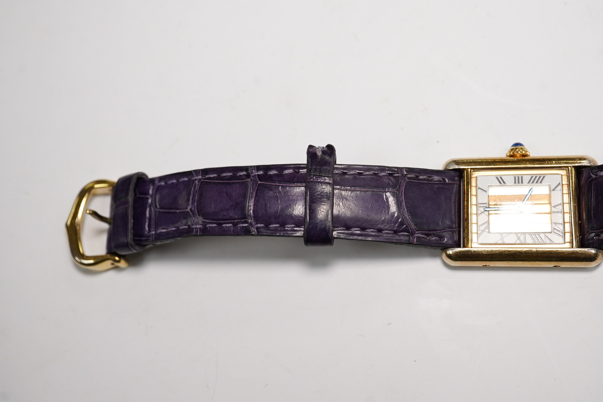 A lady's Cartier Vermeil Tank gilt 925 quartz wrist watch, with cabochon sapphire set crown and Cartier leather strap, cased diameter 20mm, no box or papers. Condition - poor to fair